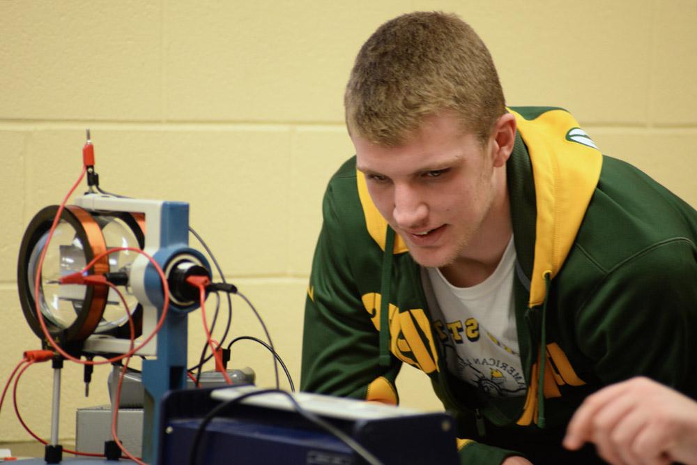 student in physics lab